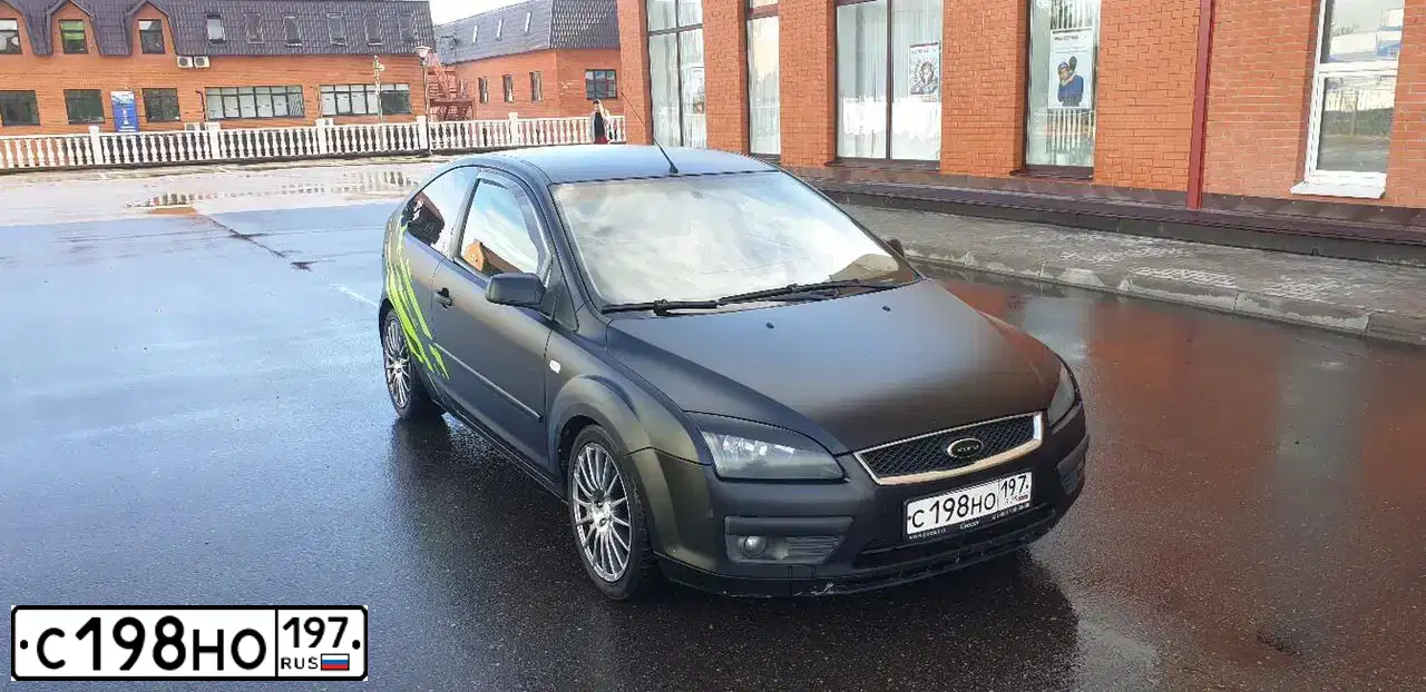 Фото автомобиля FORD FOCUS, 2006 — госномер Т027КР31. Цвет: ЧЕРНЫЙ