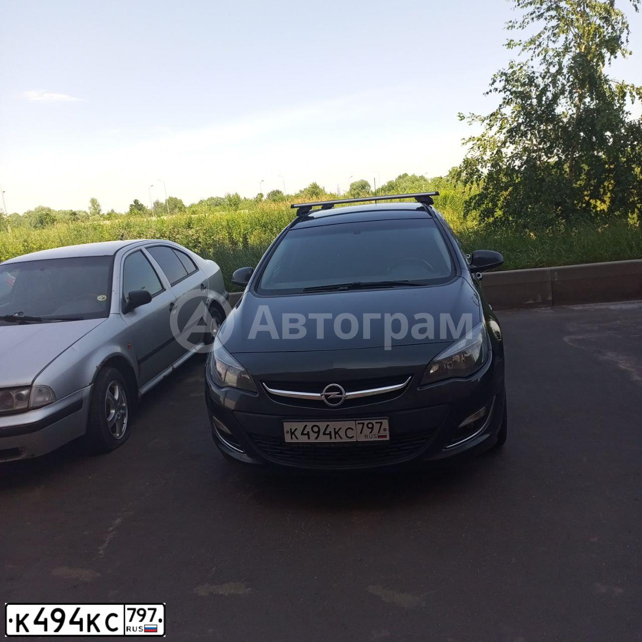 Фото автомобиля OPEL ASTRA, 2013 — госномер К494КС797. Цвет: ЧЕРНЫЙ