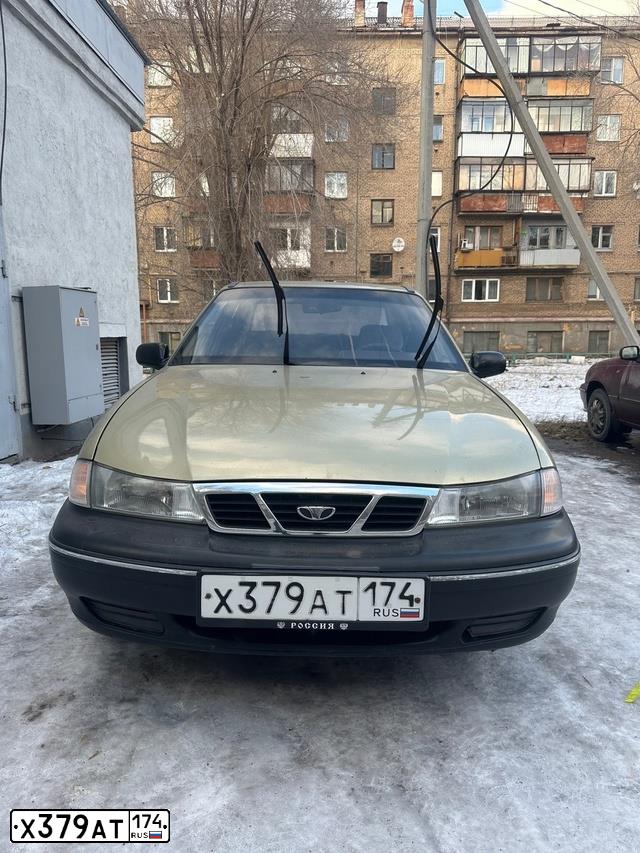 Фото автомобиля DAEWOO NEXIA, 2007 — госномер Х379АТ174. Цвет: ПЕСОЧНО-БЕЖЕВЫЙ