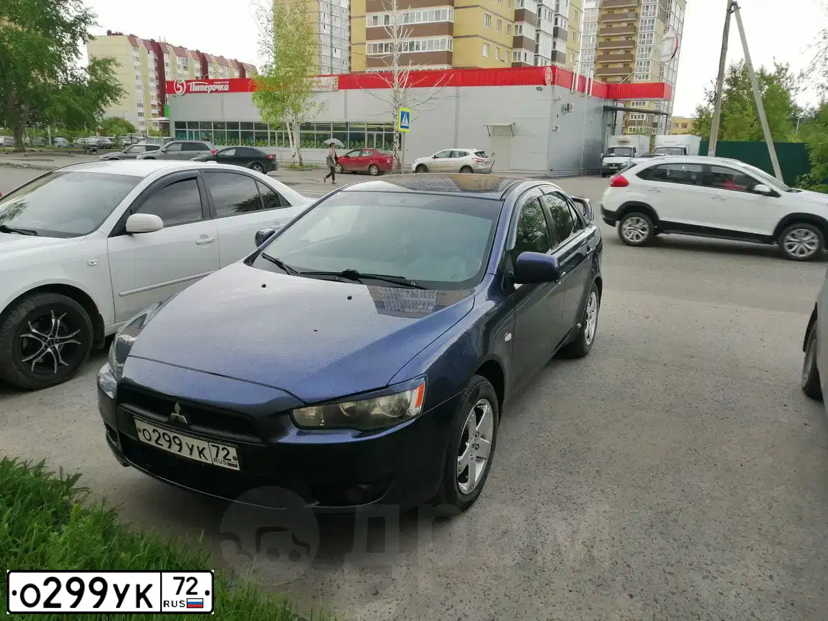 Фото автомобиля MITSUBISHI LANCER, 2007 — госномер О299УК72. Цвет: синий