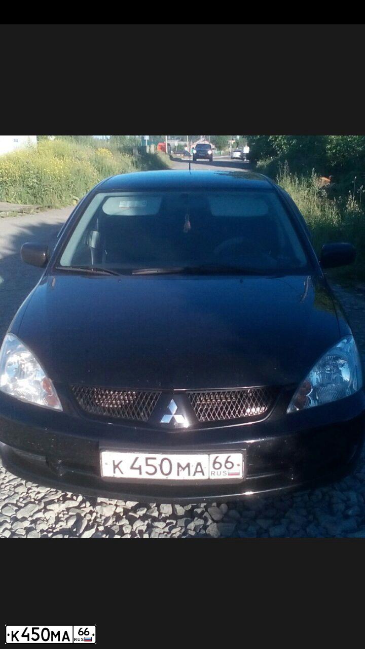 Фото автомобиля MITSUBISHI LANCER, 2007 — госномер К450МА66. Цвет: ЧЕРНЫЙ
