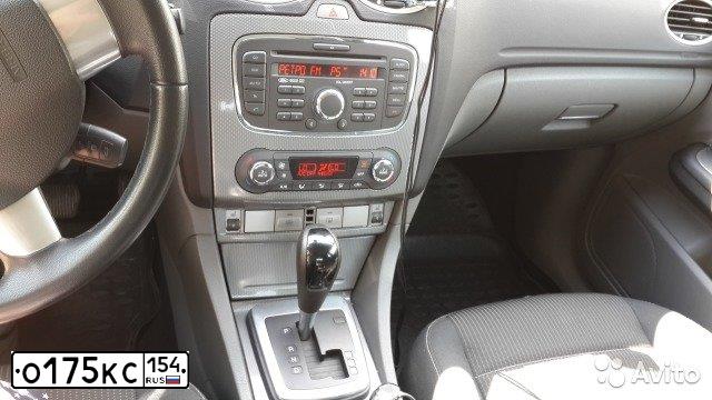 Фото автомобиля FORD FOCUS, 2010 — госномер О175КС154. Цвет: серебристый