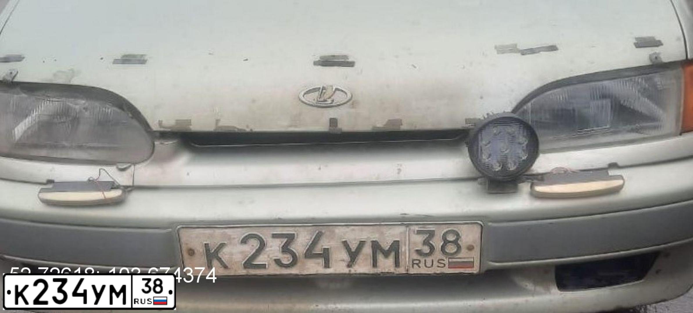Фото автомобиля LADA 2115 SAMARA, 2006 — госномер К234УМ38. Цвет: БЕЛО-ЗЕЛЕНЫЙ