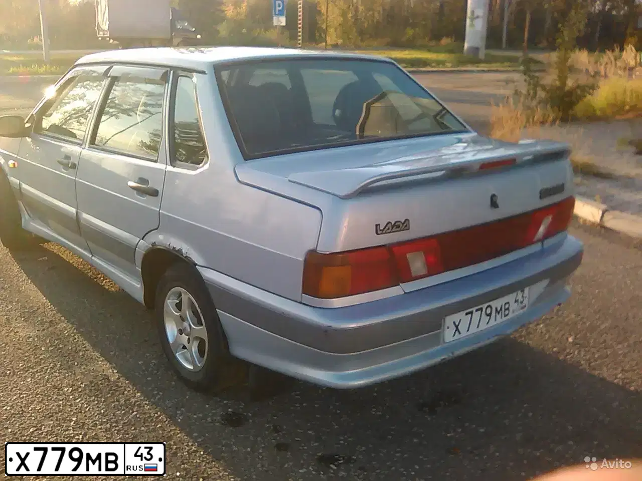 Фото автомобиля LADA 2115 SAMARA, 2005 — госномер Х779МВ43. Цвет: Серебристо-желто-голубой