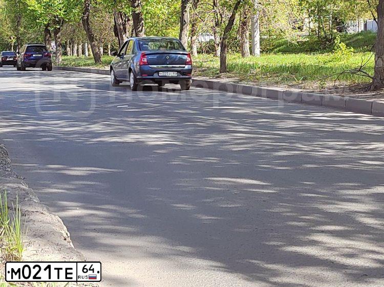 Фото автомобиля VAZ ВАЗ 21102, 2004 — госномер М021ТЕ64. Цвет: Темно Малиновый