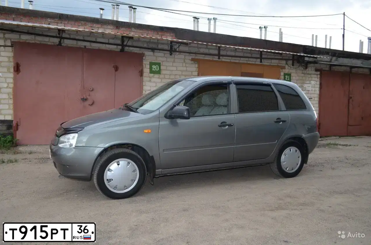 Фото автомобиля LADA 1117 KALINA, 2009 — госномер Т233ЕУ136. Цвет: Темно-серый металлик