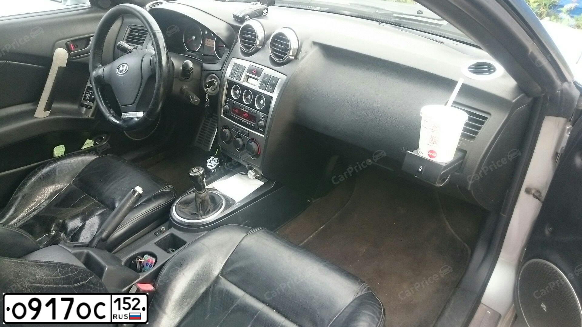 Фото автомобиля HYUNDAI /S-/COUPE / TUSCANI, 2003 — госномер О917ОС152. Цвет: Серый