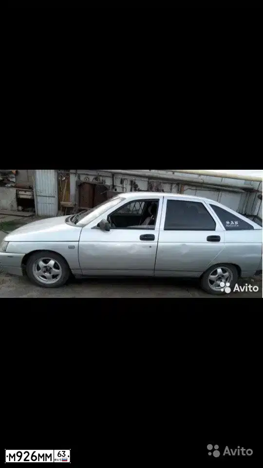 Фото автомобиля LADA 2112, 2001 — госномер Х328ВС63. Цвет: светло-серебристый металлик