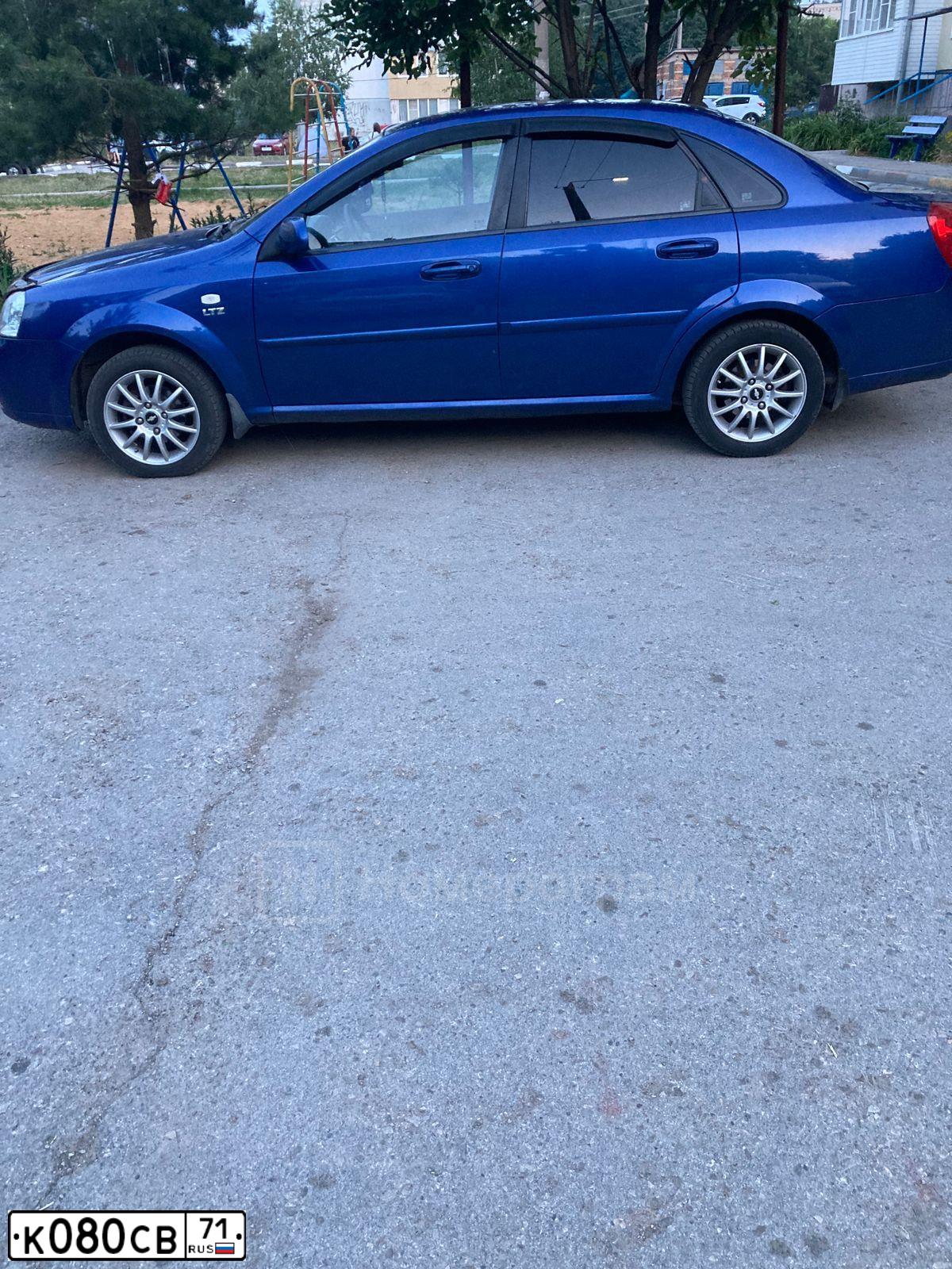 Фото автомобиля CHEVROLET LACETTI, 2009 — госномер К080СВ71. Цвет: синий