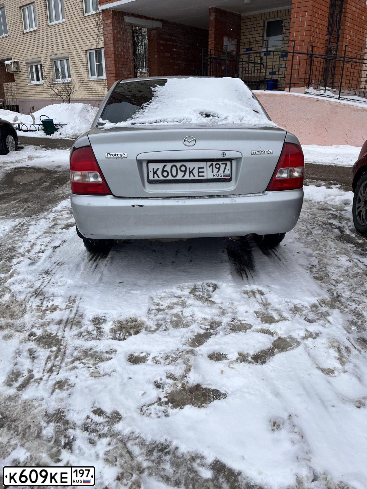 Фото автомобиля MAZDA PROTEGE, 2000 — госномер К609КЕ197. Цвет: БЕЛЫЙ (СЕРЕБРИСТЫЙ)