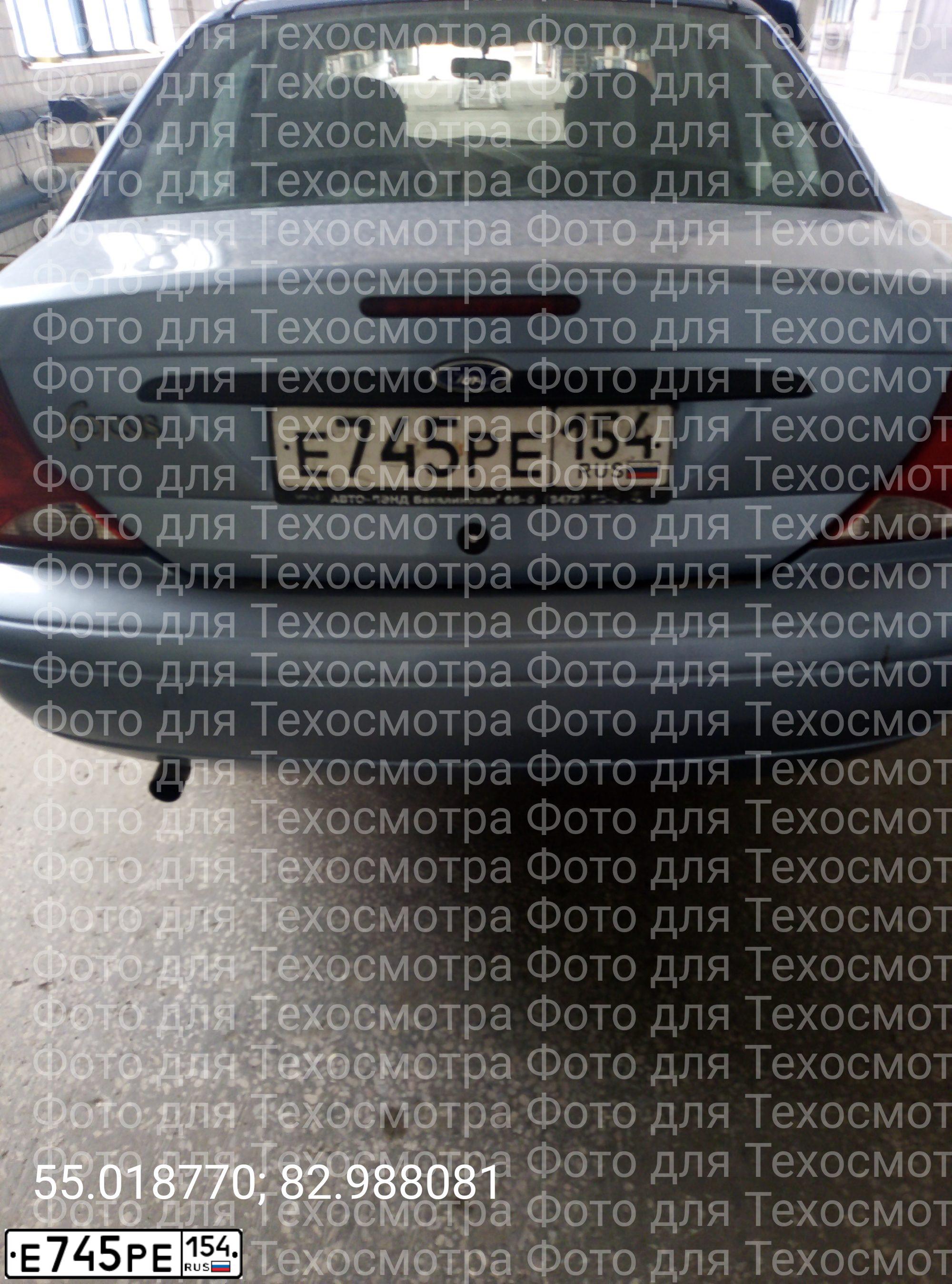 Фото автомобиля FORD FOCUS, 2005 — госномер Т745НТ154. Цвет: СВЕТЛО-СЕРЫЙ ГОЛУБОЙ