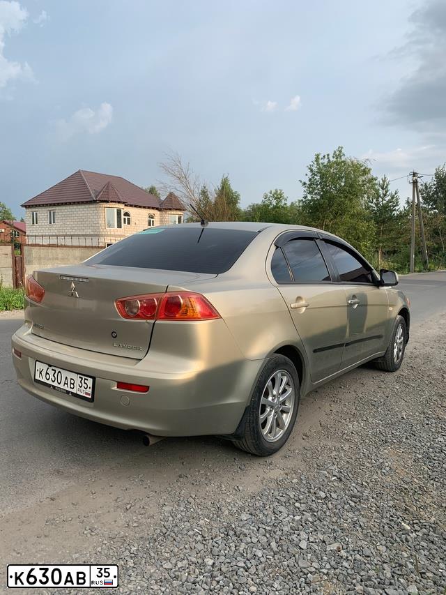 Фото автомобиля MITSUBISHI LANCER, 2008 — госномер Н671АВ35. Цвет: БЕЖЕВЫЙ