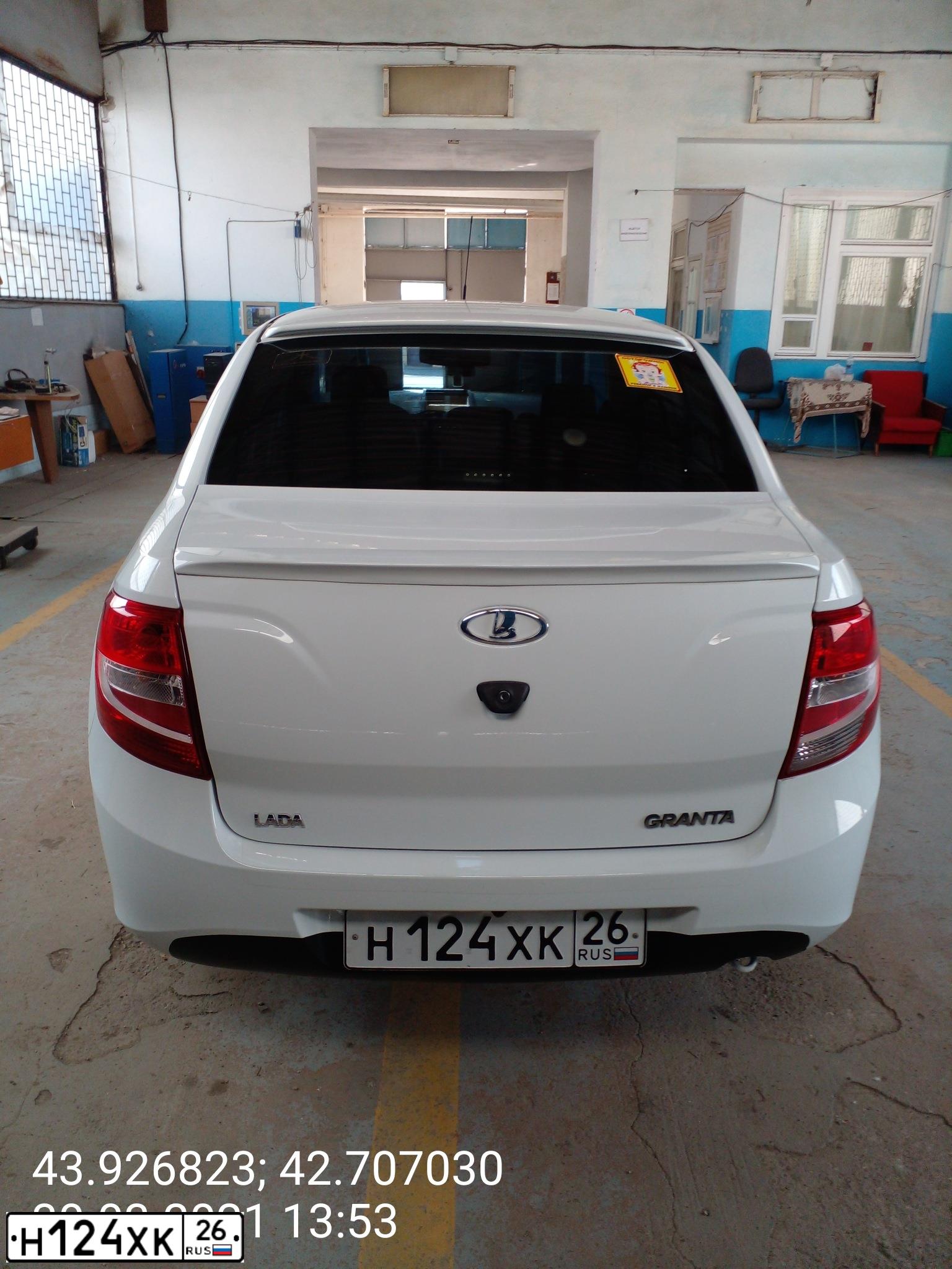 Фото автомобиля LADA 2190 GRANTA, 2013 — госномер Н124ХК26. Цвет: БЕЛЫЙ
