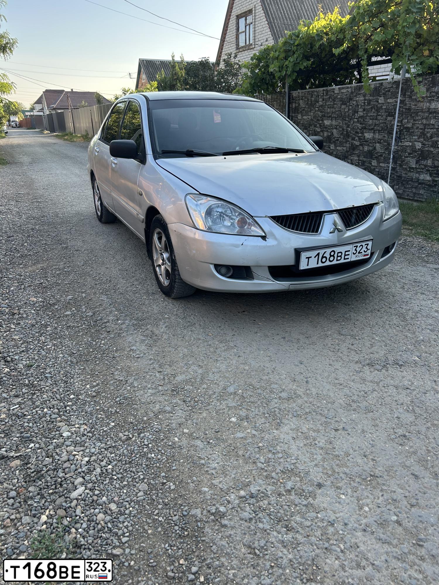 Фото автомобиля MITSUBISHI LANCER, 2003 — госномер Т168ВЕ323. Цвет: СЕРЕБРИСТЫЙ