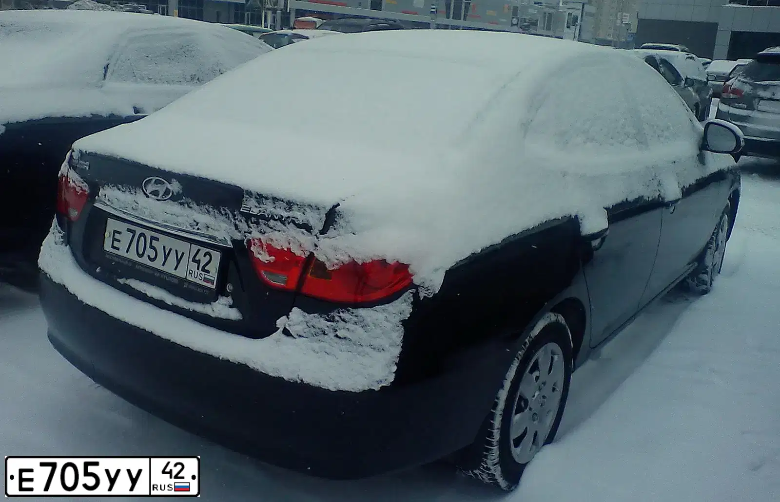 Фото автомобиля HYUNDAI ELANTRA 1.6 GLS AT, 2010 — госномер Х146СС154. Цвет: ЧЕРНЫЙ