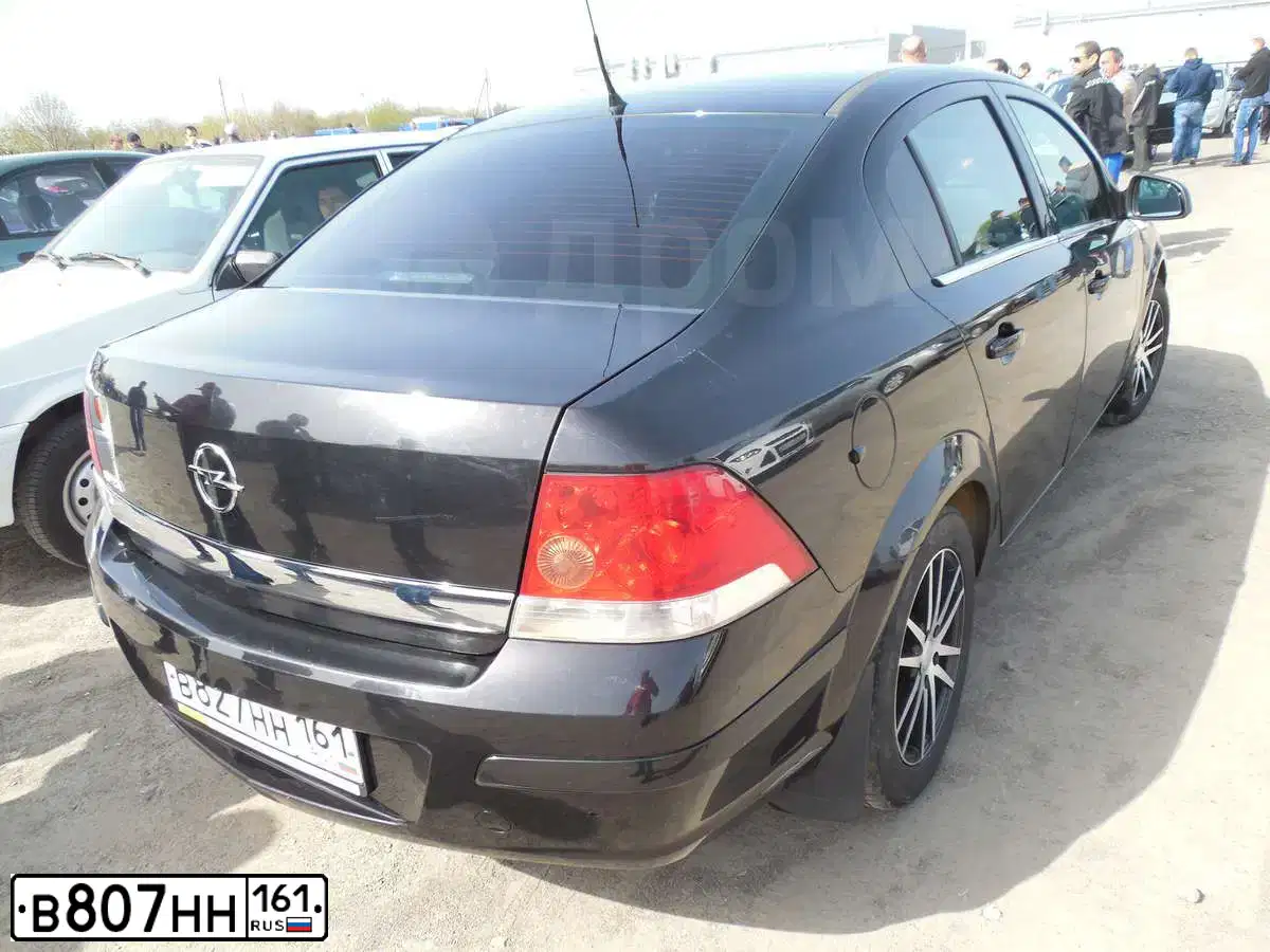 Фото автомобиля CHEVROLET AVEO, 2011 — госномер К629АХ761. Цвет: КРАСНЫЙ