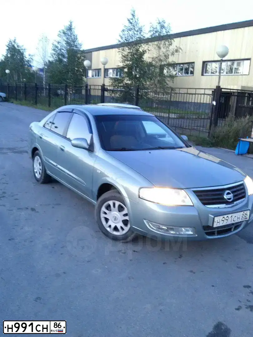 Фото автомобиля NISSAN ALMERA, 2007 — госномер Н991СН86. Цвет: СЕРО-ЗЕЛЕНЫЙ