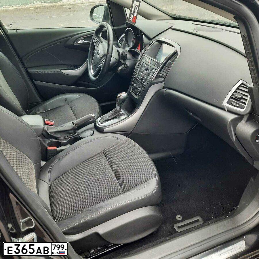 Фото автомобиля OPEL ASTRA, 2012 — госномер Х002ММ99. Цвет: ЧЕРНЫЙ МЕТАЛЛИК
