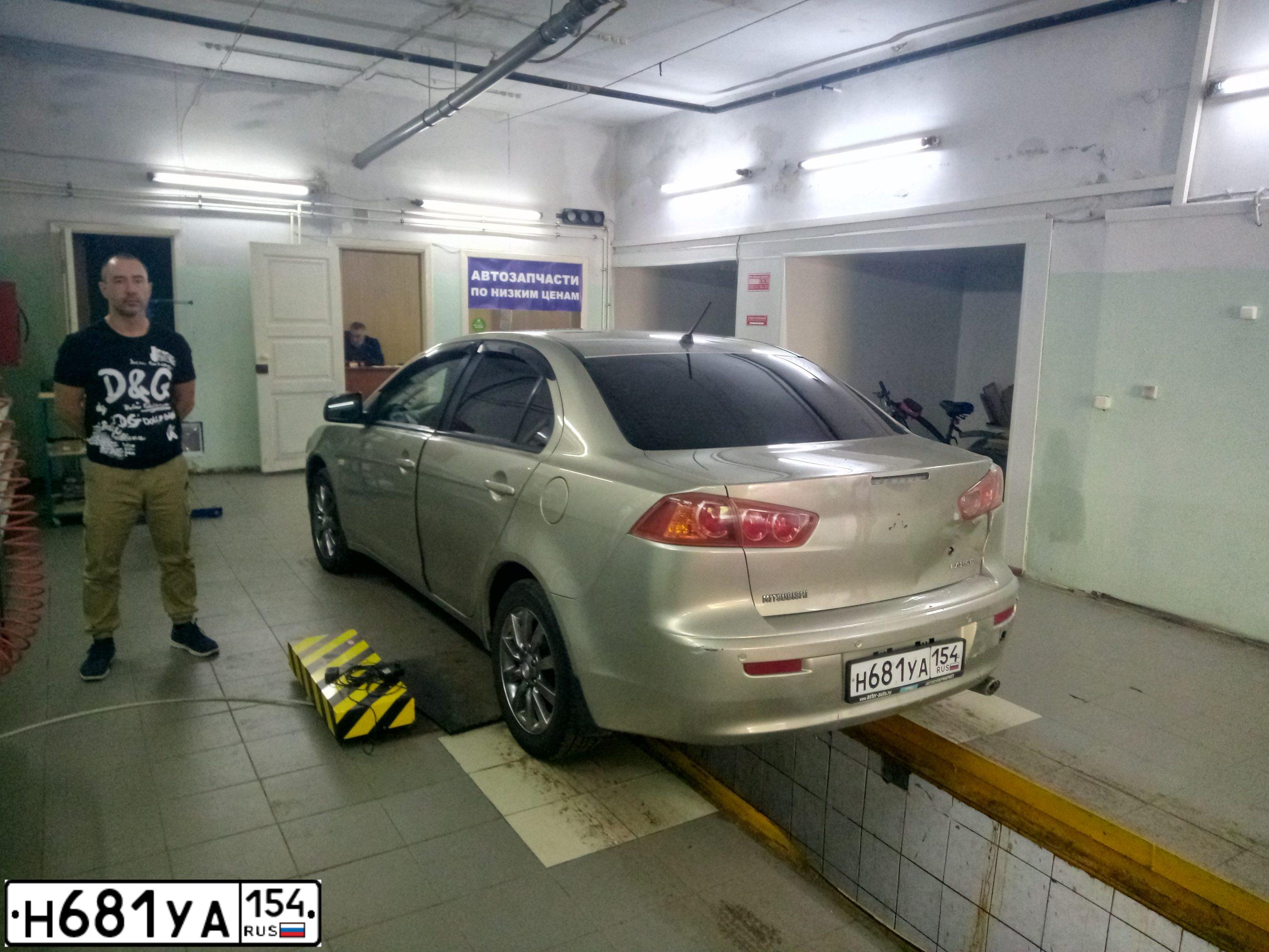 Фото автомобиля MITSUBISHI LANCER, 2007 — госномер А166ОК155. Цвет: БЕЖЕВЫЙ