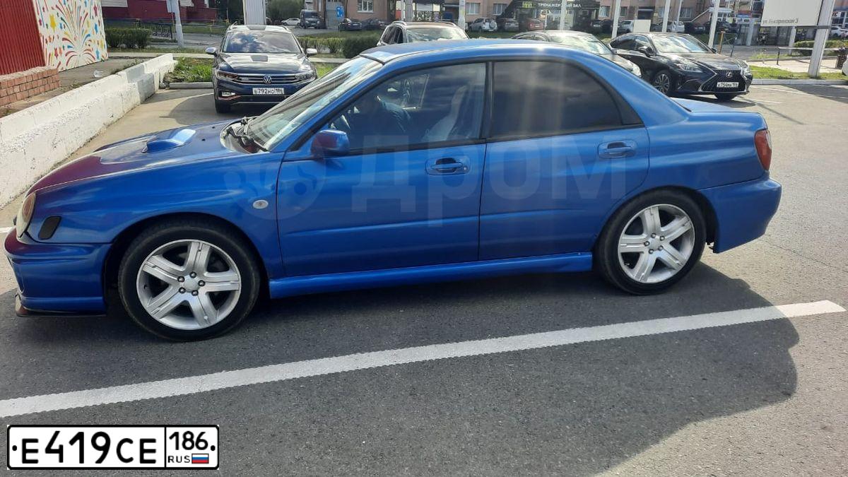 Фото автомобиля SUBARU IMPREZA, 2002 — госномер Е419СЕ186. Цвет: синий