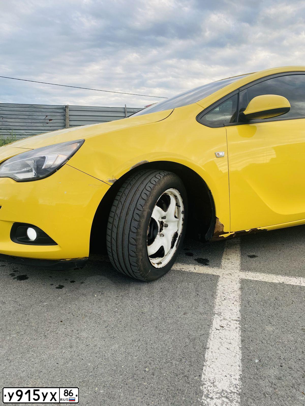 Фото автомобиля OPEL ASTRA, 2011 — госномер Р391ЕХ774. Цвет: ЖЁЛТЫЙ