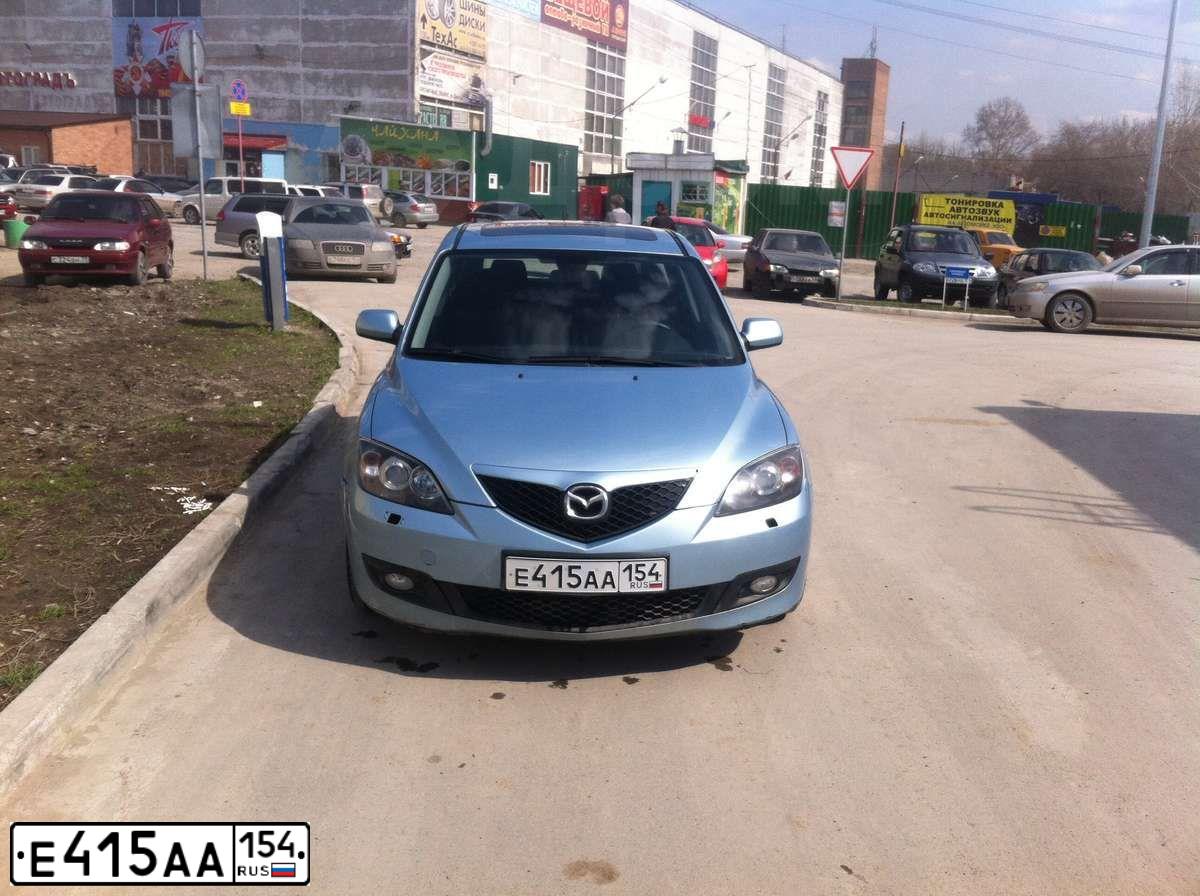 Фото автомобиля MAZDA 3, 2006 — госномер Е415АА154. Цвет: СЕРЫЙ МЕТАЛЛИК