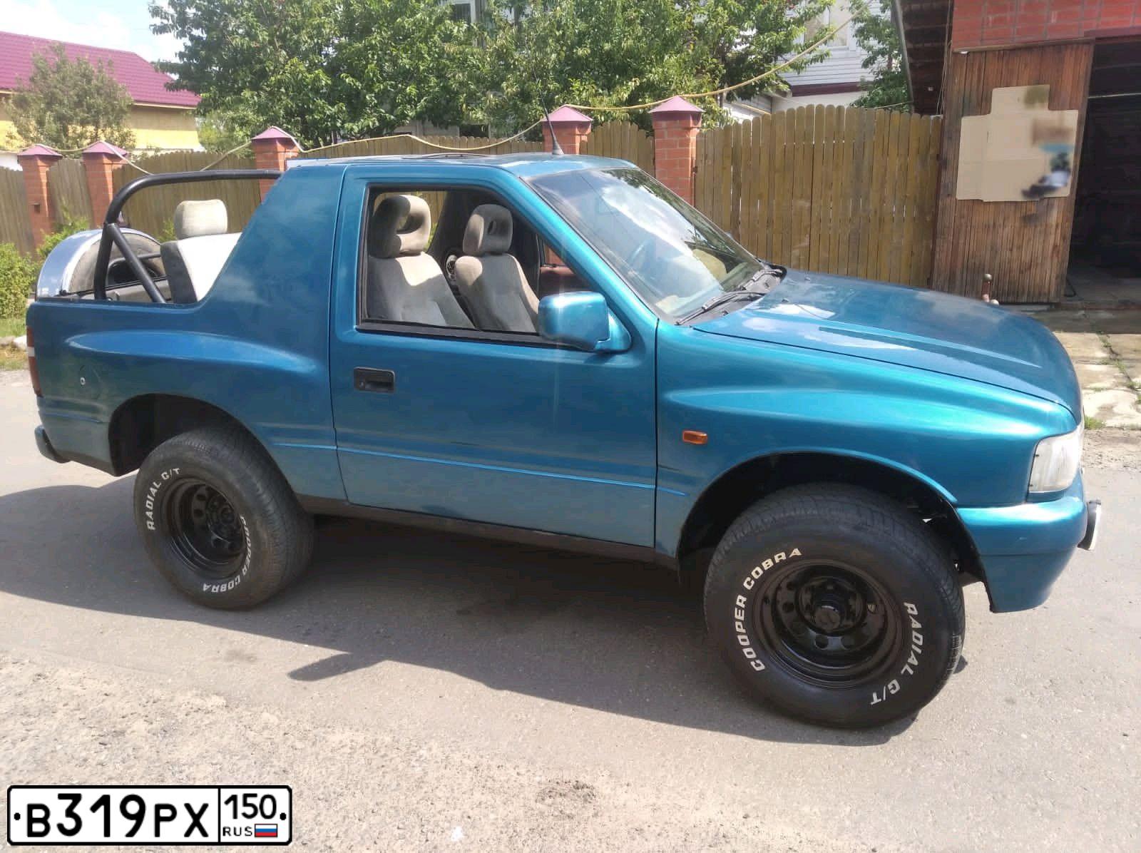Фото автомобиля OPEL FRONTERA, 1993 — госномер Т812ХС97. Цвет: голубой