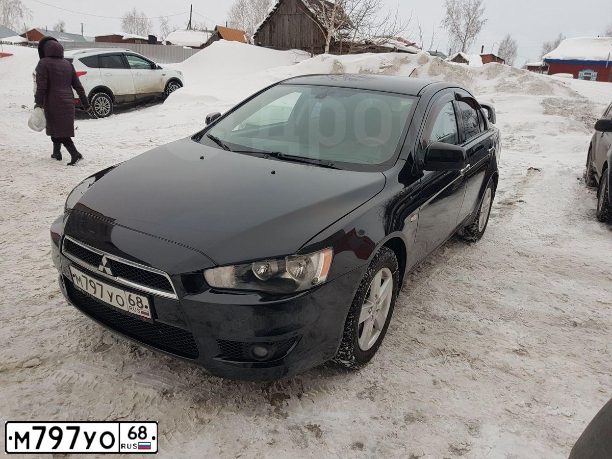 Фото автомобиля MITSUBISHI LANCER, 2008 — госномер Е338МА122. Цвет: ЧЕРНЫЙ