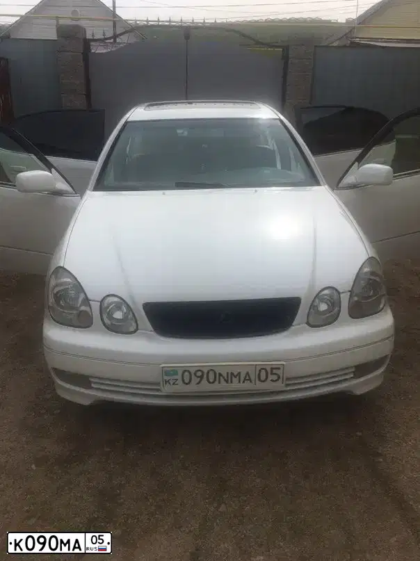 Фото автомобиля LADA 2114 SAMARA, 2009 — госномер К090МА05. Цвет: ЗОЛОТИСТО-КРАСНЫЙ