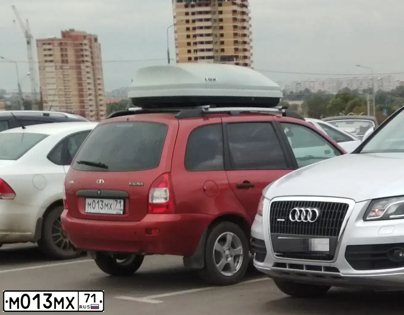 Фото автомобиля LADA 1117 KALINA, 2012 — госномер М013МХ71. Цвет: СЕРЕБРИСТО-КРАСНЫЙ