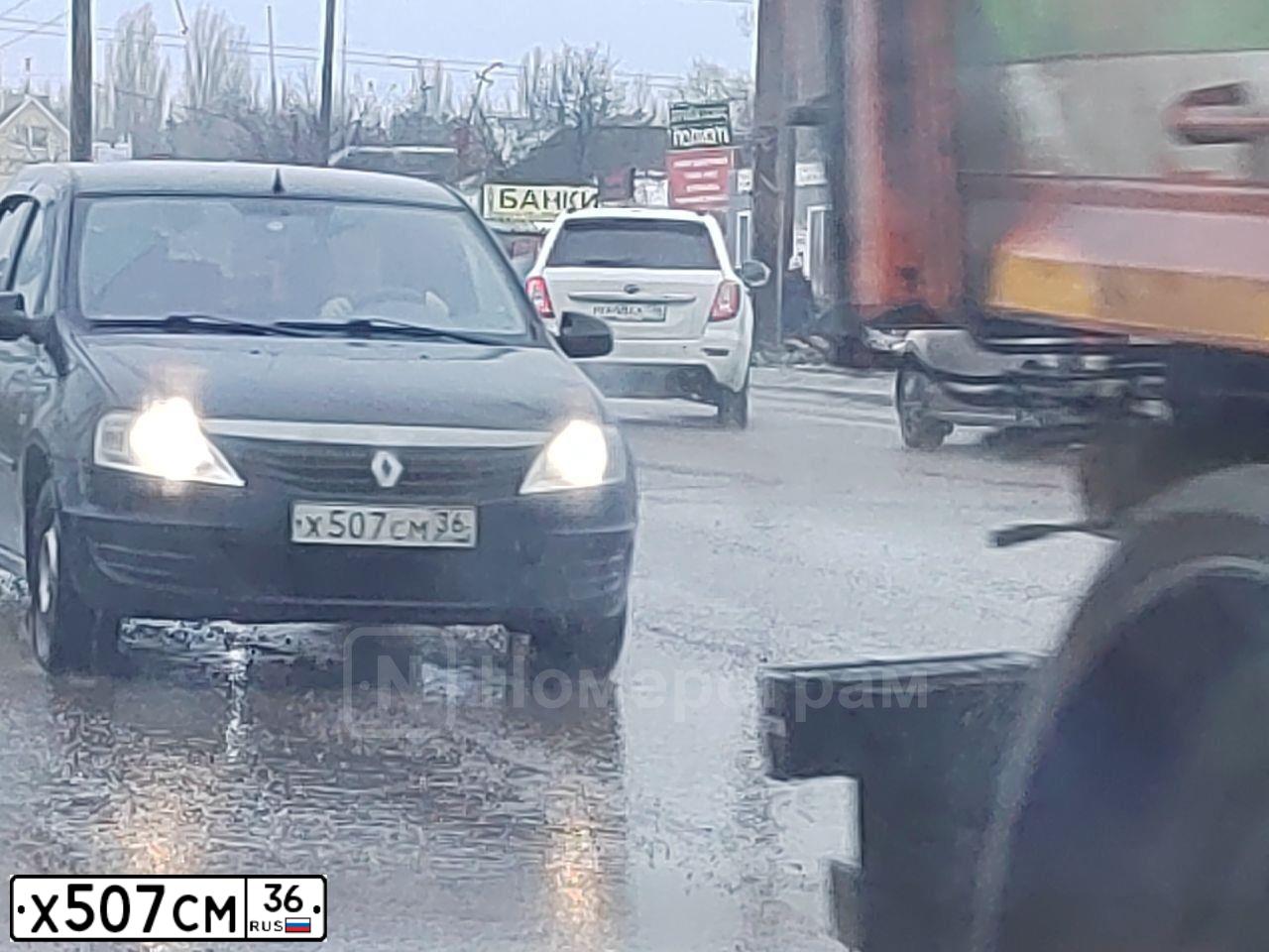 Фото автомобиля RENAULT LOGAN, 2010 — госномер Х507СМ36. Цвет: ЧЕРНЫЙ
