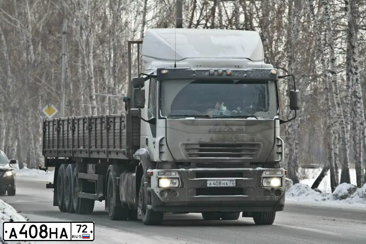 Фото автомобиля IVECO STRALIS, 2006 — госномер А408НА72. Цвет: Белый