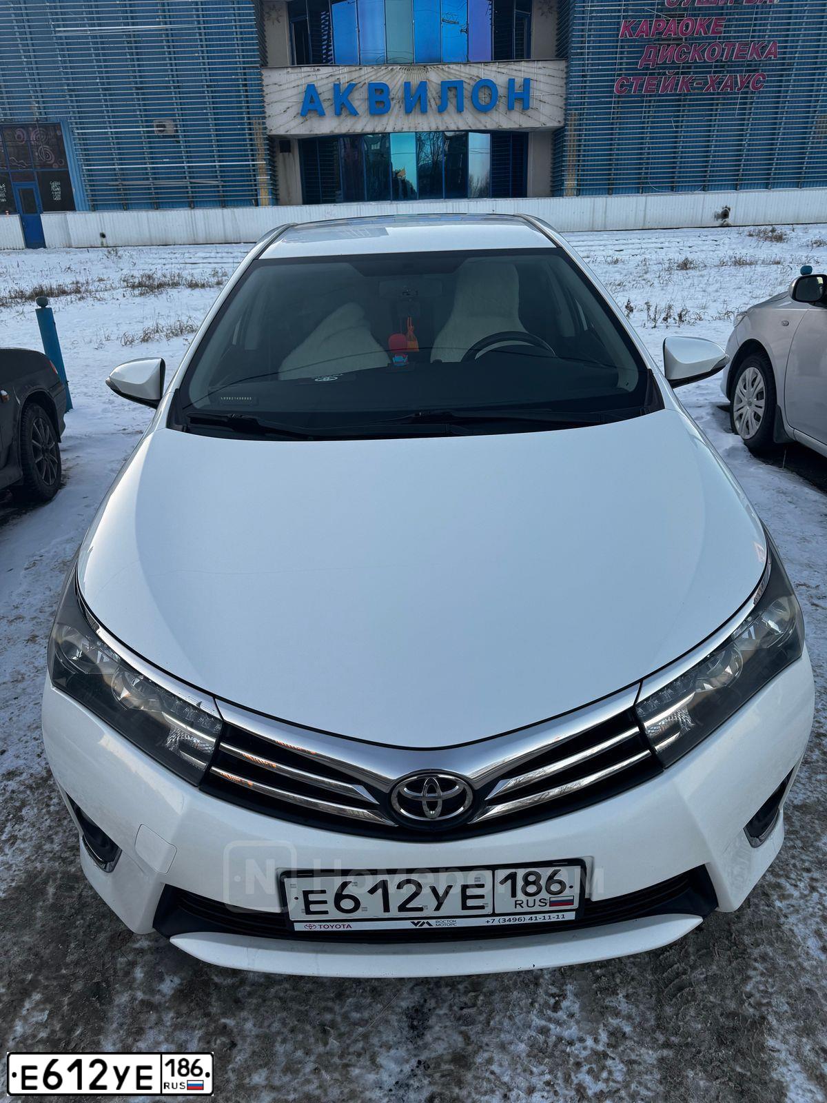 Фото автомобиля TOYOTA COROLLA, 2014 — госномер Е612УЕ186. Цвет: Белый