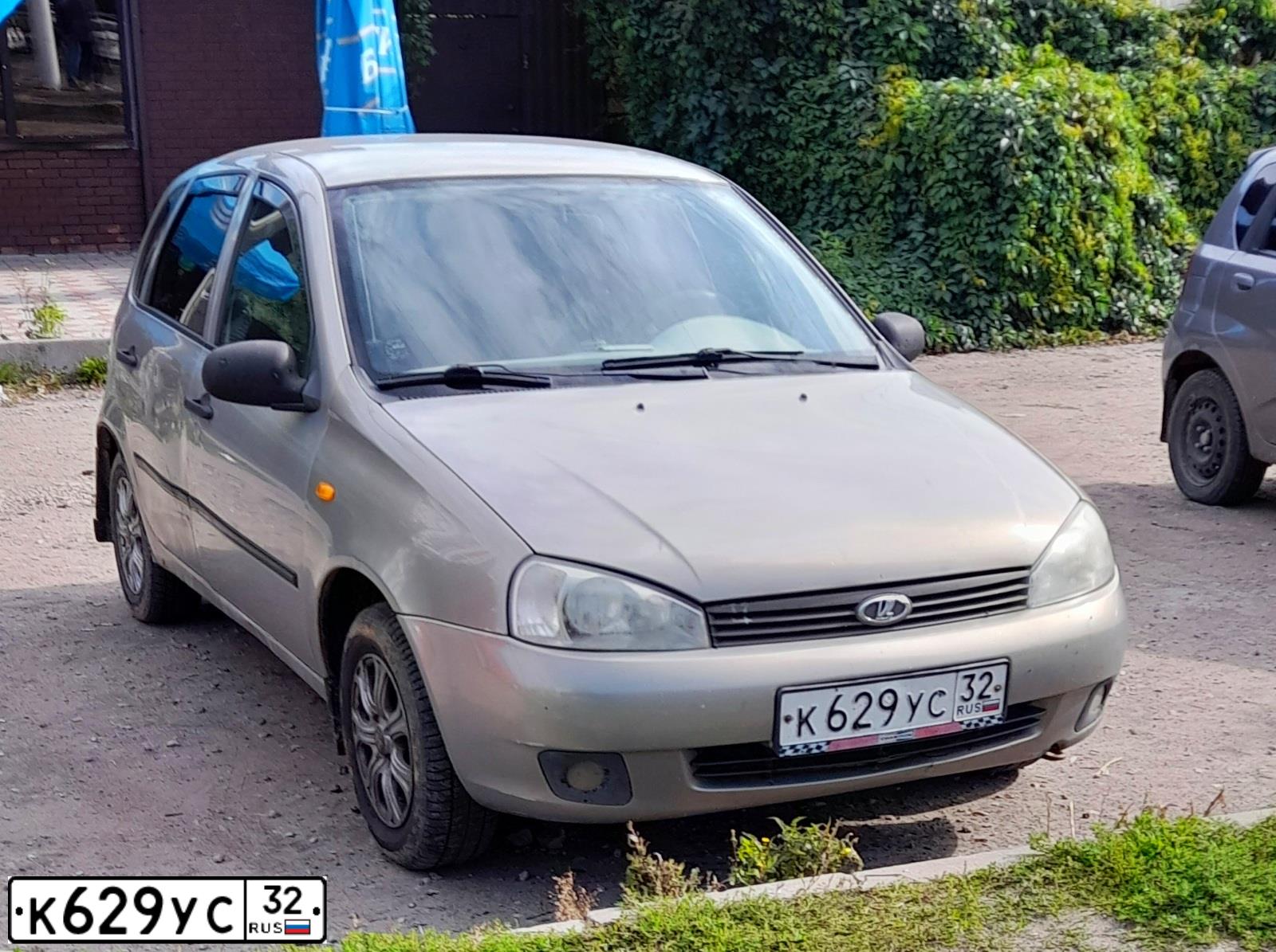 Фото автомобиля LADA KALINA, 2006 — госномер А219НК57. Цвет: БЕЖЕВО-СЕРЫЙ