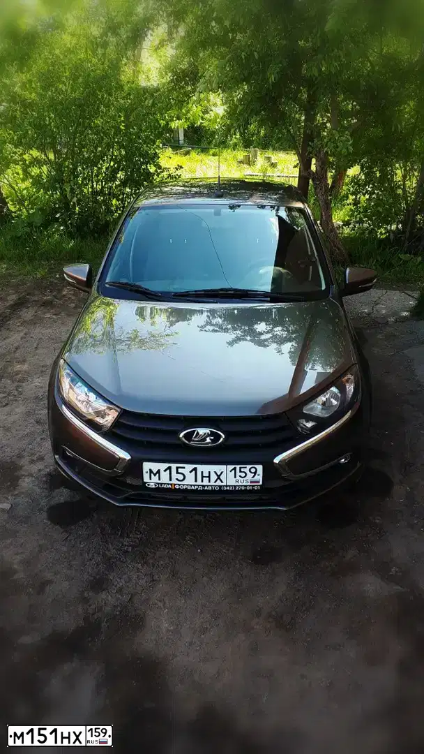 Фото автомобиля LADA 2190 GRANTA, 2018 — госномер М151НХ159. Цвет: золотисто коричневый