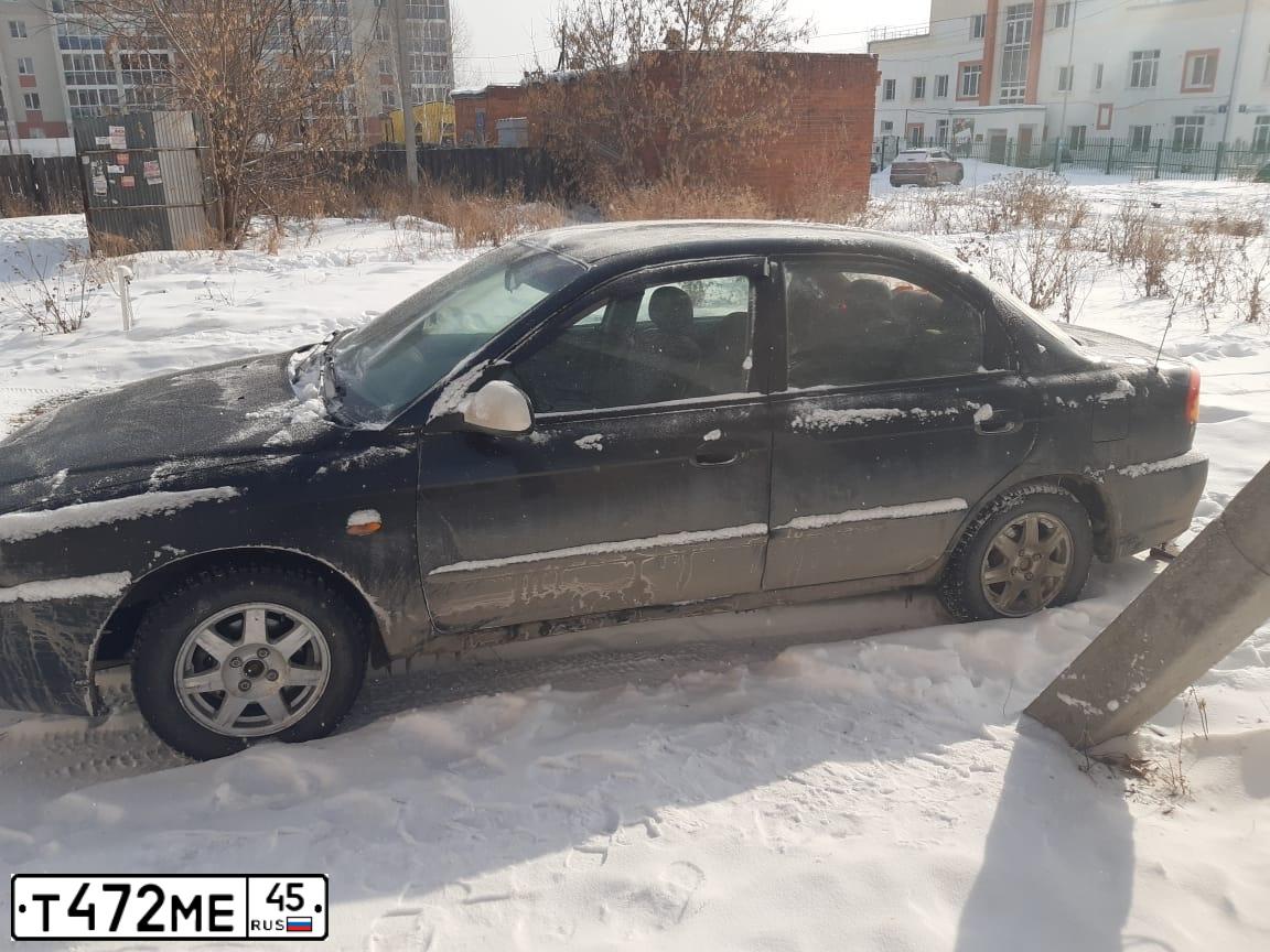 Фото автомобиля KIA SPECTRA, 2007 — госномер Т472МЕ45. Цвет: ЧЕРНЫЙ ЖЕМЧУГ