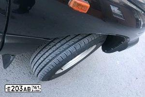 Фото автомобиля CHEVROLET NIVA, 2007 — госномер Е203АВ161. Цвет: Черно-синий металлик