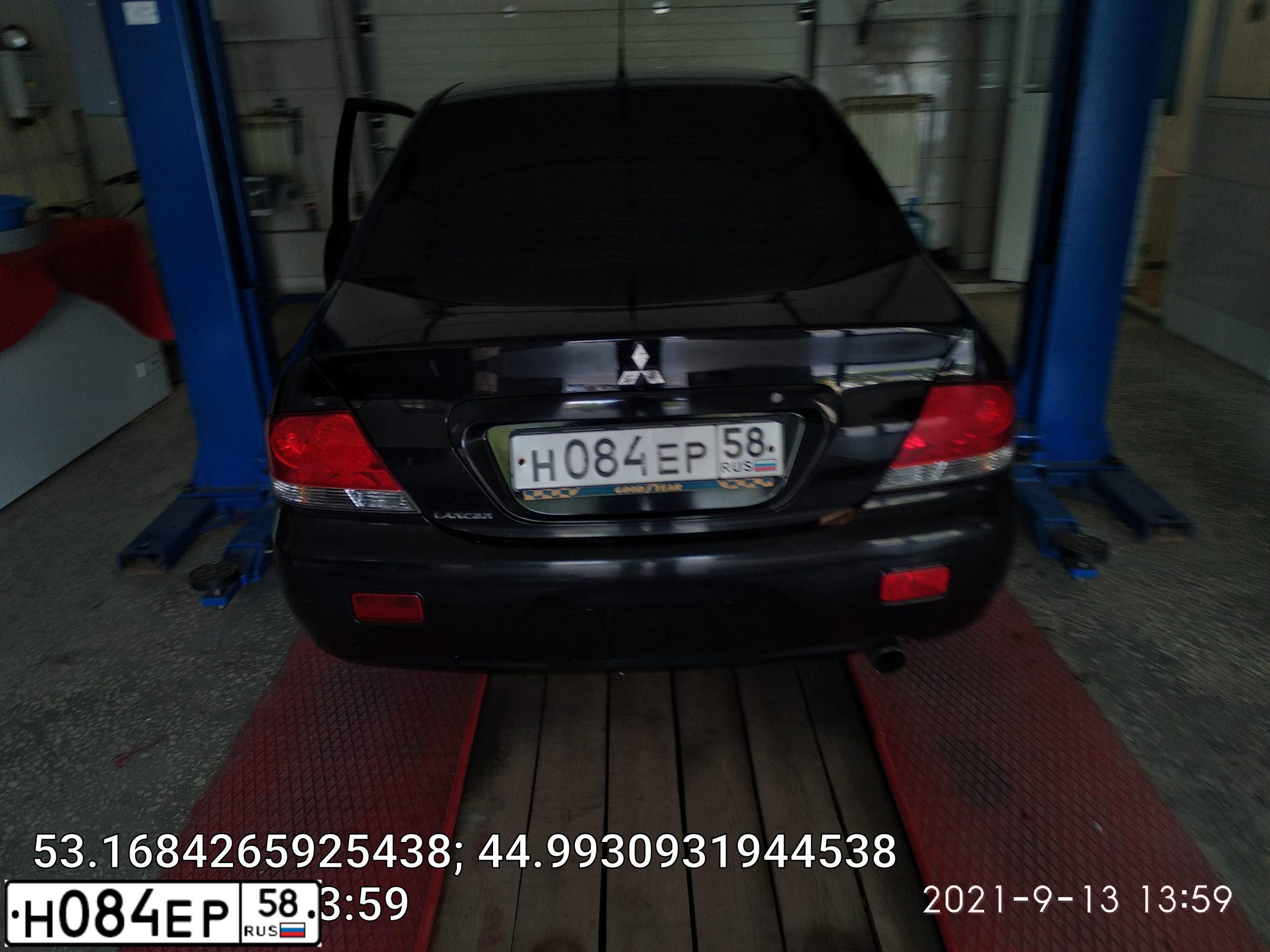 Фото автомобиля MITSUBISHI LANCER, 2004 — госномер М054РМ134. Цвет: ЧЕРНЫЙ
