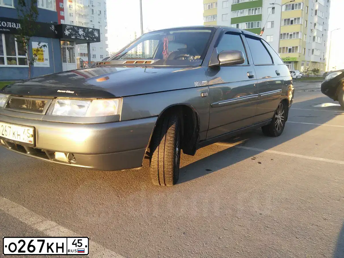 Фото автомобиля LADA 2112, 2007 — госномер О267НК45. Цвет: СЕРО-ЗЕЛЕНЫЙ