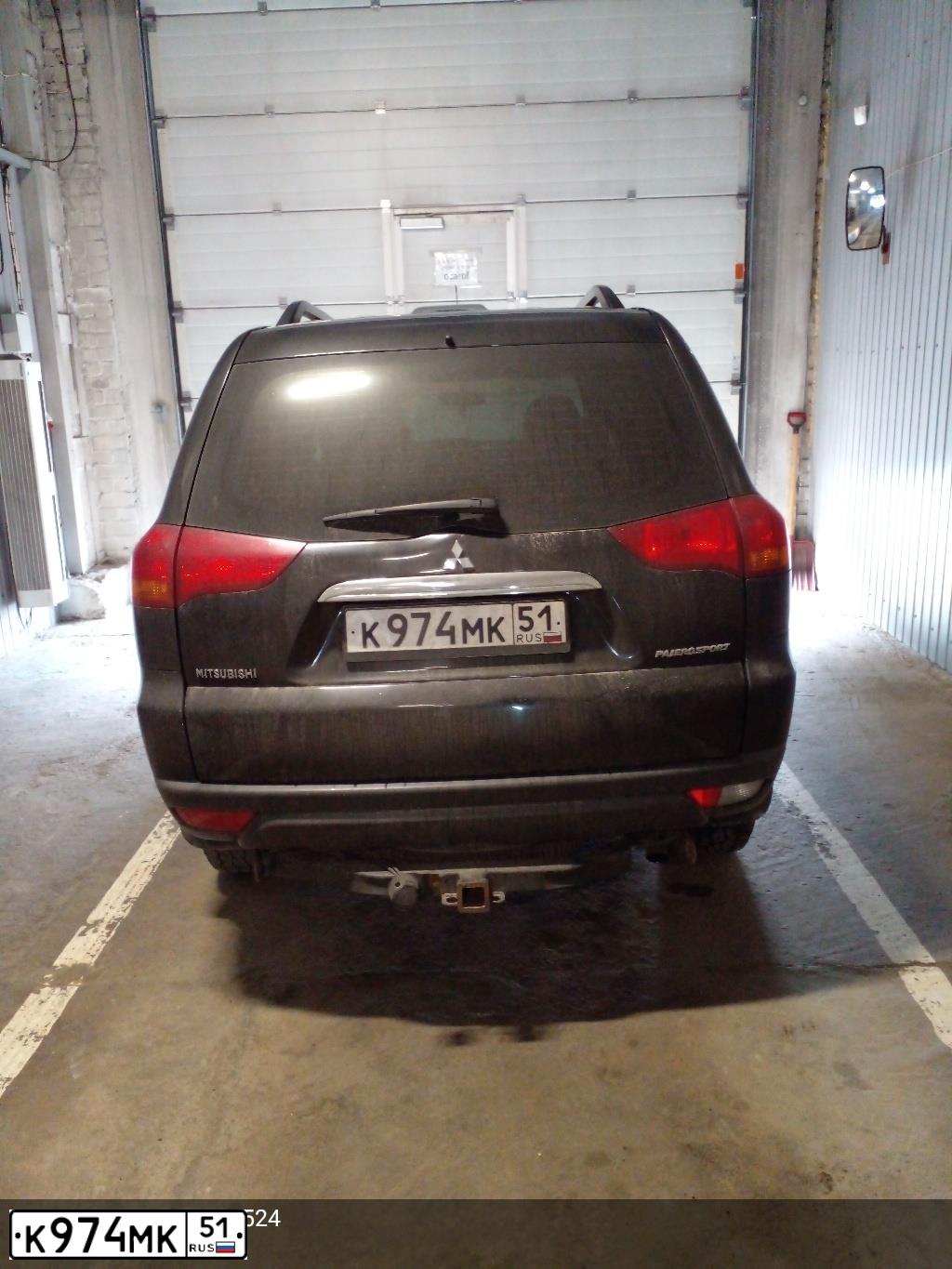 Фото автомобиля MITSUBISHI PAJERO SPORT, 2012 — госномер К974МК51. Цвет: ЧЕРНЫЙ