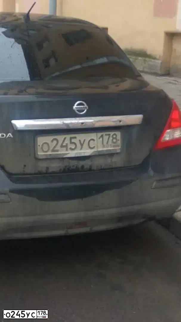 Фото автомобиля NISSAN TIIDA, 2008 — госномер О245УС178. Цвет: ЧЕРНЫЙ