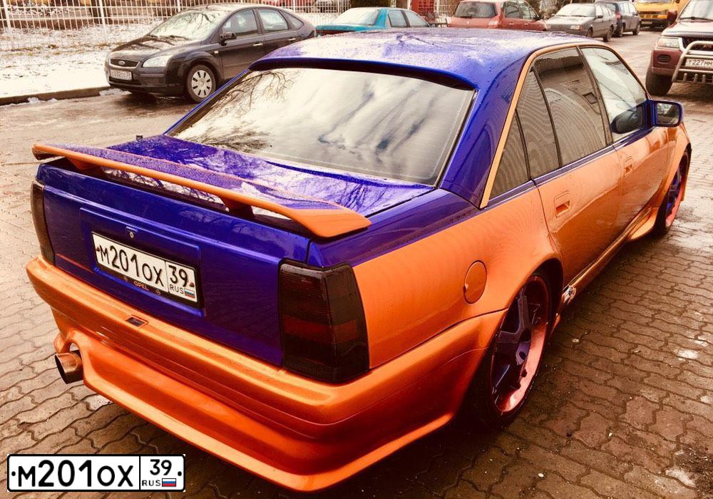 Фото автомобиля OPEL OMEGA, 1992 — госномер М201ОХ39. Цвет: ЗОЛОТИСТЫЙ
