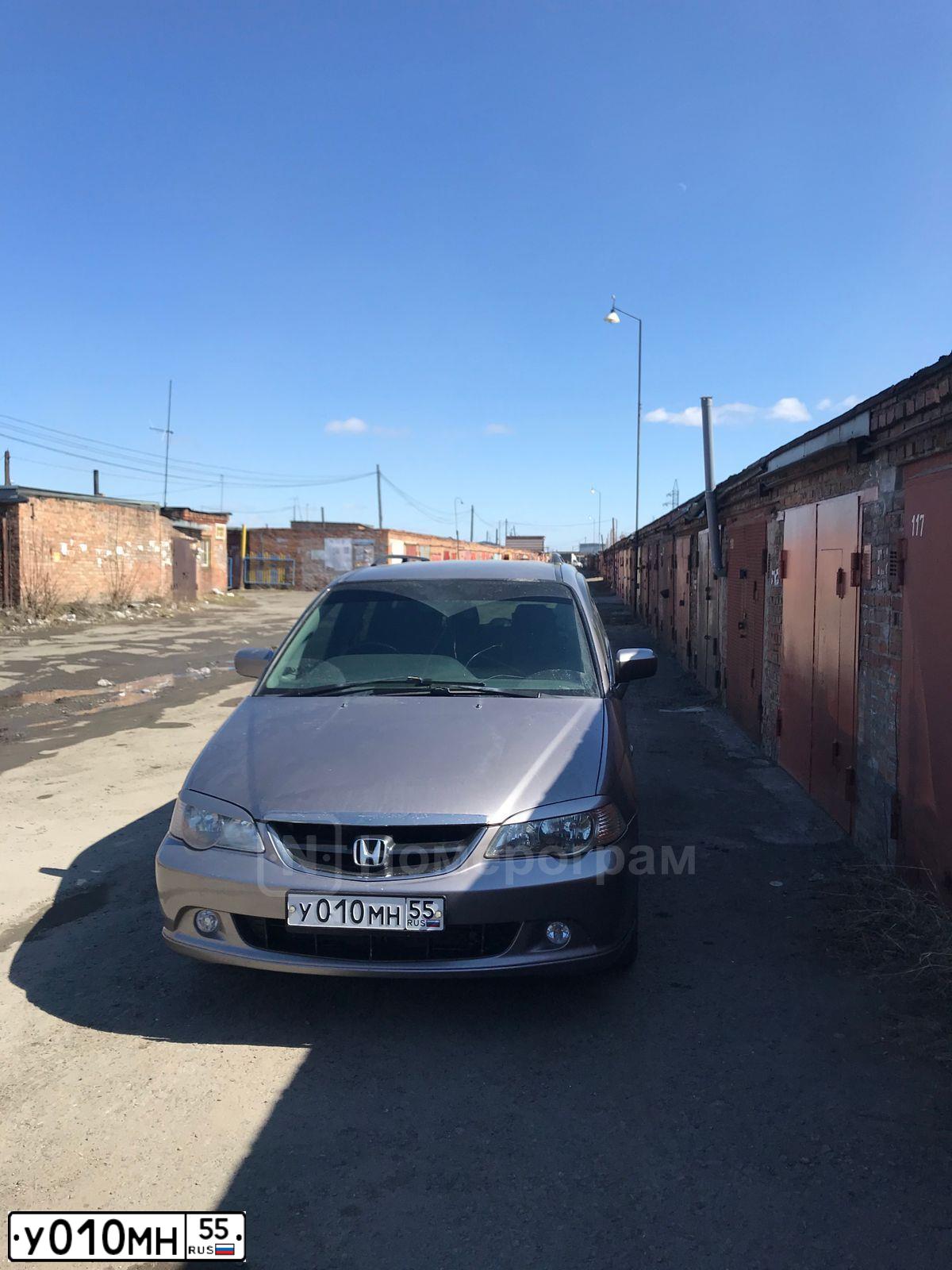 Фото автомобиля SUBARU OUTBACK, 2010 — госномер У010МН55. Цвет: ЧЕРНЫЙ