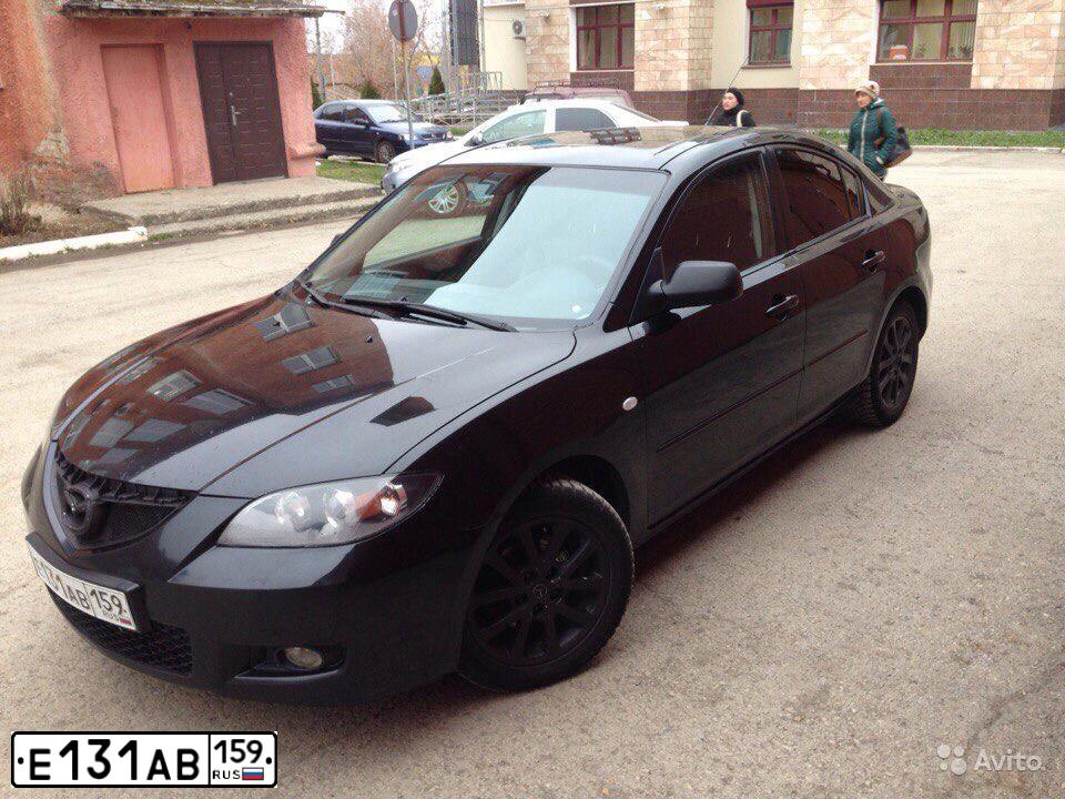 Фото автомобиля MAZDA 3, 2006 — госномер Е131АВ159. Цвет: ЧЕРНЫЙ