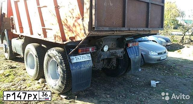 Фото автомобиля KAMAZ 65115 /6X4/, 2004 — госномер Р147РХ36. Цвет: Оранжевый