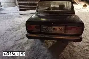 Фото автомобиля LADA 2107 LADA, 2004 — госномер Т133ВР05. Цвет: ФИОЛЕТОВЫЙ