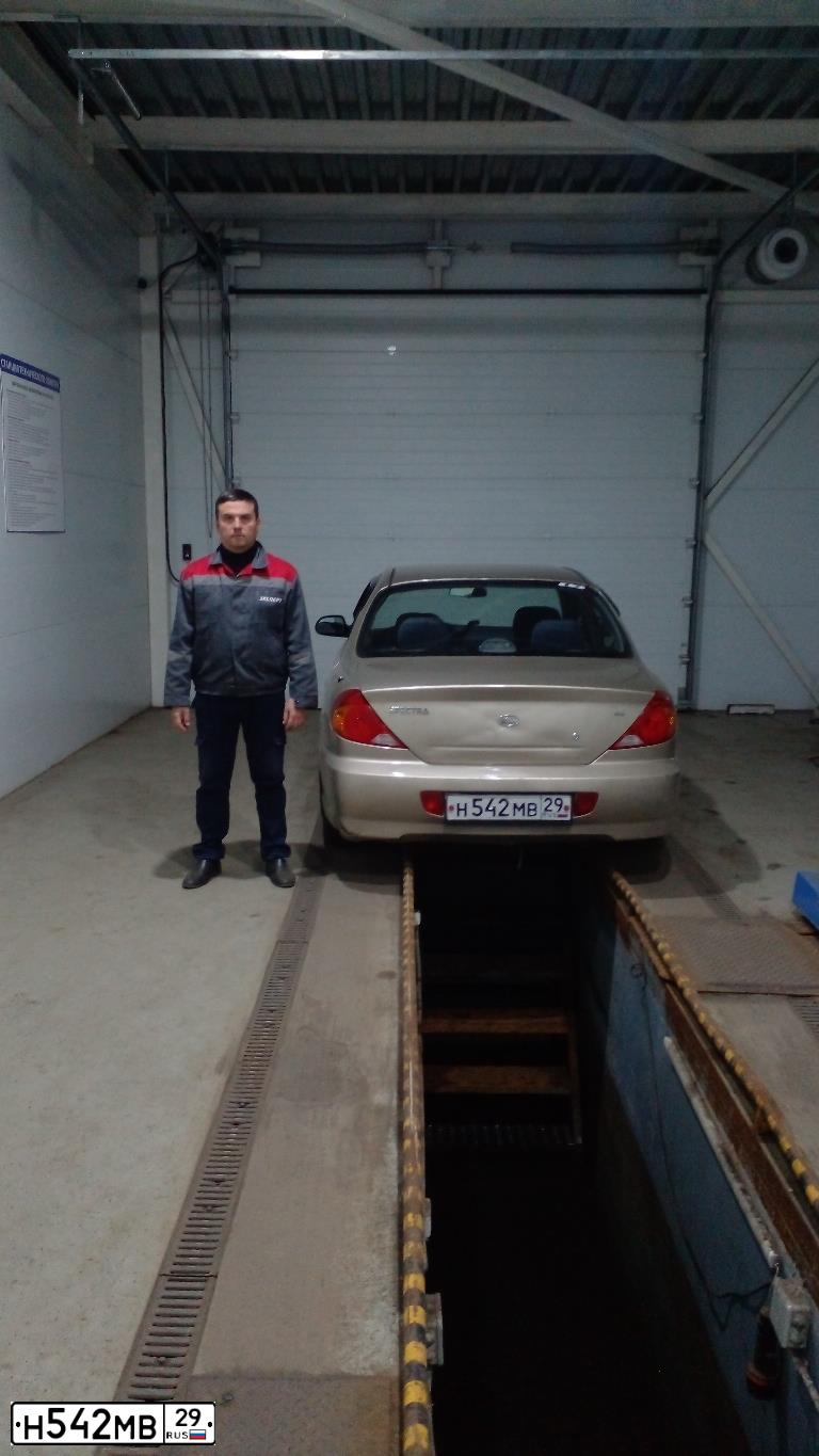 Фото автомобиля KIA SPECTRA, 2008 — госномер Н542МВ29. Цвет: Золотисто-бежевый
