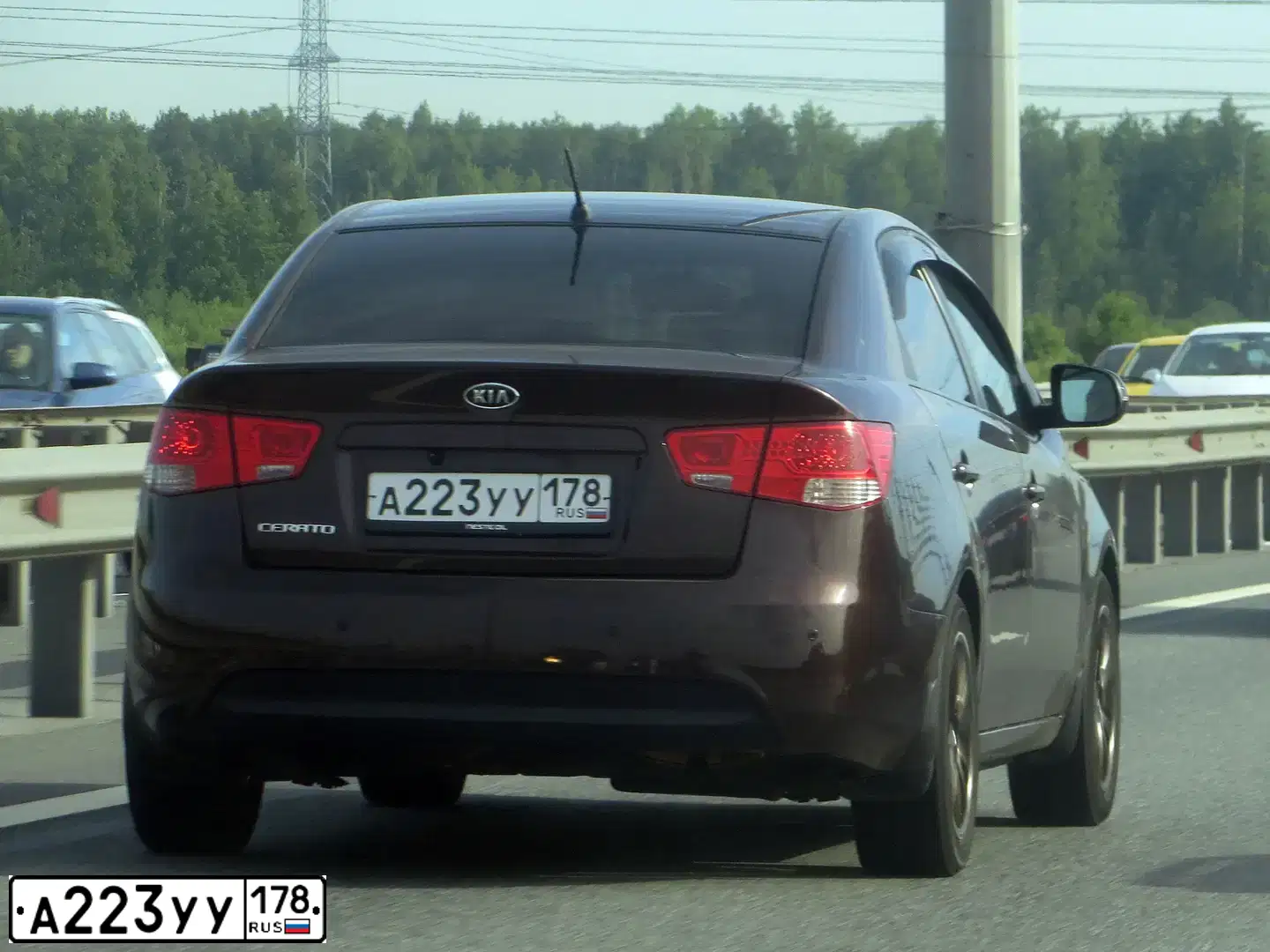 Фото автомобиля KIA CERATO, 2010 — госномер А223УУ178. Цвет: ТЕМНО-ВИШНЕВЫЙ