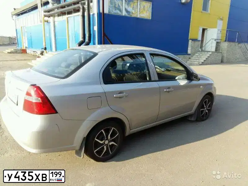 Фото автомобиля CHEVROLET AVEO, 2009 — госномер Т040СК123. Цвет: СЕРЕБРИСТЫЙ
