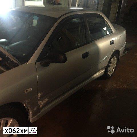 Фото автомобиля MITSUBISHI CARISMA, 2002 — госномер Т726ММ71